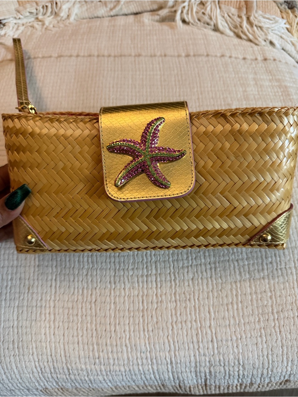 Lilly Pulitzer Jubilee clutch made of woven straw featuring a beaded starfish